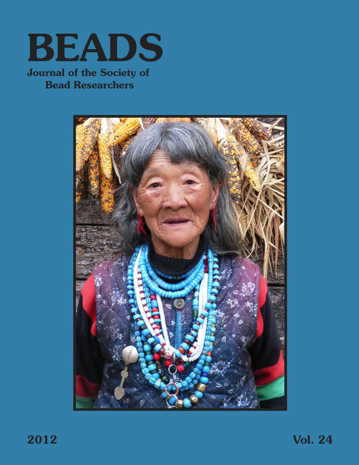 Volume 24 cover, an elderly woman wears many strands of beads.